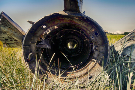 Remains of military aircraft (fighter) punched shell fragments and warmed by explosions of shells and bullets, splinter effect, fragment effect. Shoot down an aircraft, grand slamの写真素材