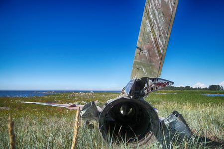 Unique foto. war plane crashed on shore of sea several years ago and lies on grassy dunes. Different camera angles at different timesの写真素材