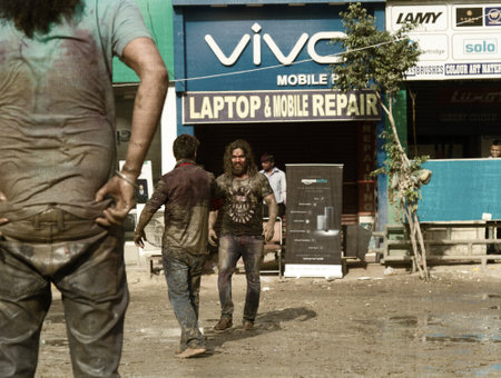 India, new Delhi - March 1, 2018: mock fights between men during the Holy festival of Holi.のeditorial素材