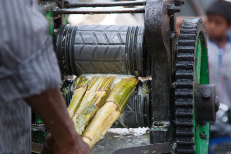 India, Pushkar-March 3, 2018: process of making sugar cane juiceのeditorial素材