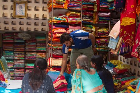 India, Pushkar-March 3, 2018: main charm of the Bazaar. shop beautiful world famous Oriental fabrics and outfits.のeditorial素材