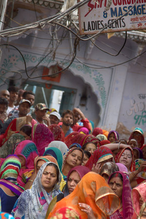 India, Pushkar-March 4, 2018: women go after a religious ceremony on the narrow streetsのeditorial素材
