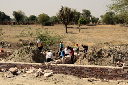 India, Jaisalmer - March 5, 2018: construction of a brick building by Indian builders almost only handsのeditorial素材