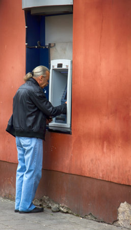 Lithuania, Vilnius - September 5, 2017: Euro cash withdrawal at ATM in capitalのeditorial素材