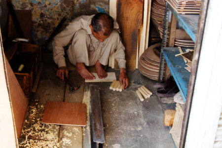 India, new Delhi - March 26, 2018: hand-made carpenter in a small roomのeditorial素材