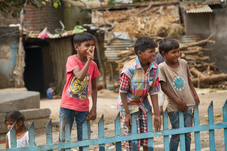 India, Pune - April 6, 2018: Indian children in the yard of his house.のeditorial素材