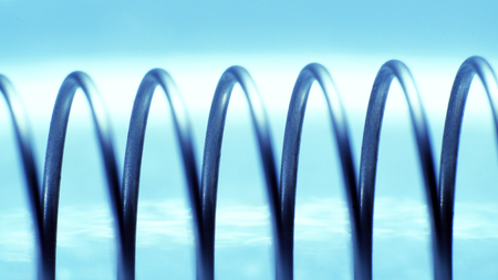 spring metal close-up ultra macro. part from the computer printer after disassemblyの写真素材