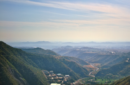 Lesser Himalayas. Mountain landscapes of spring time with peaks and ridges in the blue distance