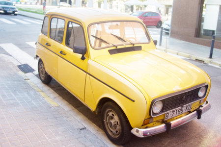 Lloret de Mar, Spain-October 5, 2017: Old car. Yellow Renault 4TL. Front, side and rear view