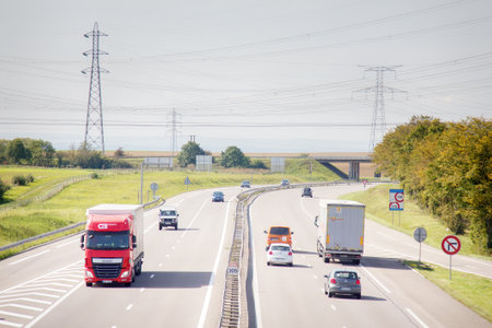 Chateau-Thierry, France - September 21, 2017: movement of trucks and passenger transport on highwayのeditorial素材