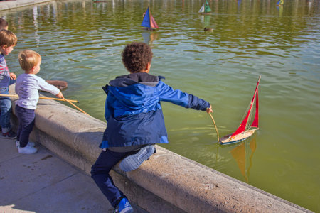 Paris, France - September 23, 2017: Parisians let boats in the pond, scale modeling. Many Parisians vacationersのeditorial素材