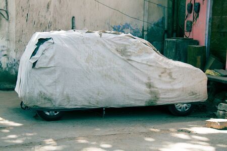 Car awning, vehicle curtain from an old tarpaulin on a new carの写真素材