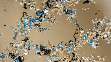 Plastic gets into water basin and gradually destroyed by waves and sun. Plastic particles accumulate in fields and lumps on water surface and in the thickness. Plastic contaminationの写真素材