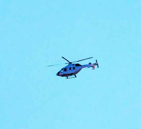 Figure blue helicopter in the blue sky