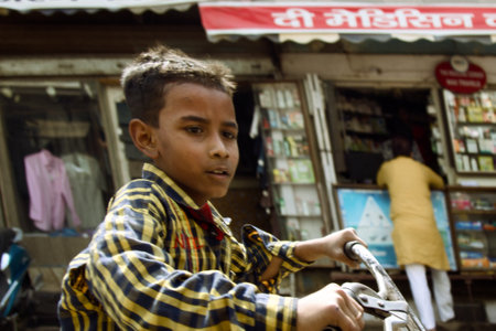 India, Mahora-March 22, 2018: boy on a bike, dynamic photoのeditorial素材