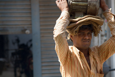 India, Mahora-March 22, 2018: the man is on the head of the motor (engine)のeditorial素材