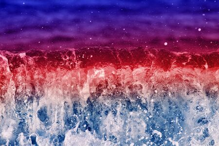 Bright coastal color wave with splashes. Joy to visit the sea on vacationの写真素材