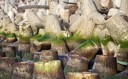 The seawall around the sea port facilities is made of concrete tetrapods (traveling-wave...