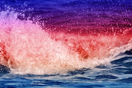 Bright coastal color wave with splashes. Joy to visit the sea on vacationの写真素材
