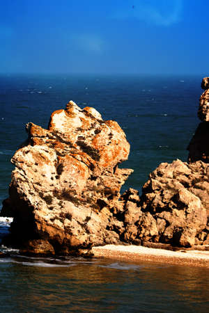 Limestone outlier goes into sea in form of a stone Cape. Coastal erosion of softer rocks. Beautiful lost little visited places for solitary meditationの写真素材