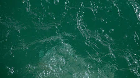 Beautiful paradise tropical water background with water sprayの写真素材