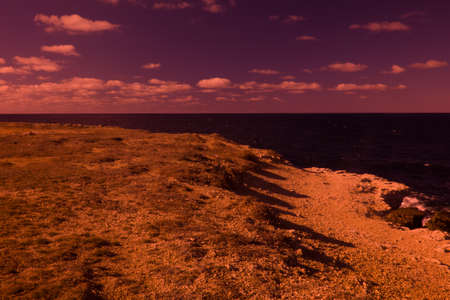 Mystical seaside with rocks. The magic and beauty of the sea. Surrealistic art infrared photoの写真素材
