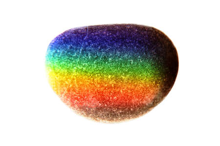 Zen stone in touch of rays of color. The concept of maximum joy from colorの写真素材