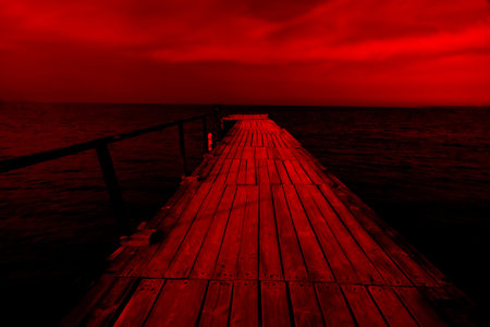 Pier overlooking the open sea. Surrealistic art infrared photoの写真素材