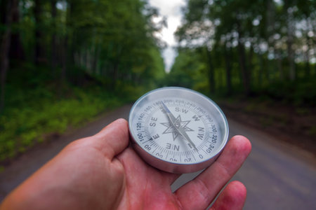 The right compass is always needed for travelers, adequate course. Hiking through the road network of Siberiaの写真素材