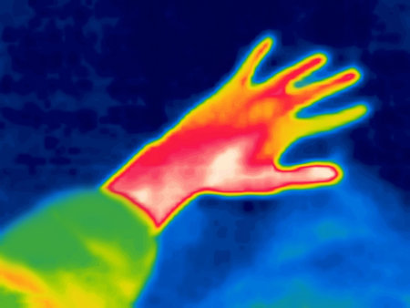 Hand gestures captured on thermal imager device. Warm hands of an ordinary person. Grab with hand.の写真素材