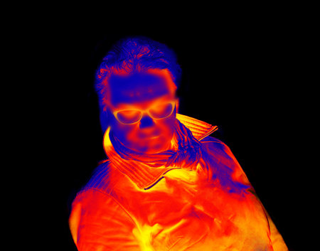 Portrait of a middle-aged man in everyday life. Thermal imaging on a white and black background....