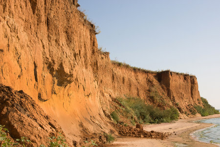 30-meter clay cliffs on the banks of the Dnieper-Bug freshwater estuary as a result of current water erosion and the ancient Ozolimna sea reservoir, marine transgressionの写真素材