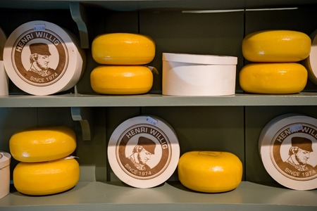 Cheese heads on display in Henry Willig store, selective focus, The Netherlands, October 12, 2017のeditorial素材