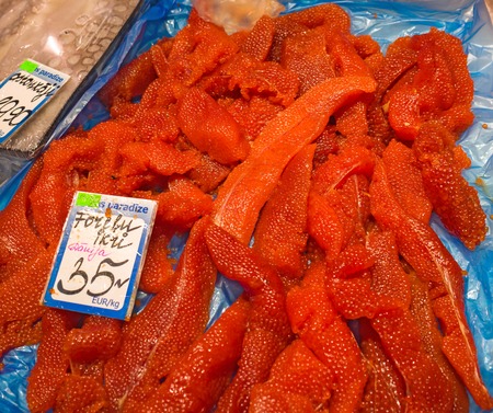 Red caviar on fish market display counter, background. Protein healthy food.の写真素材