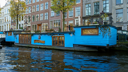 Traditional Floating boat house in Amsterdam canals, the Netherlands, October 13, 2017のeditorial素材