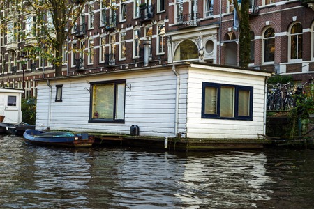 Traditional Floating boat house in Amsterdam canals, the Netherlands, October 13, 2017のeditorial素材