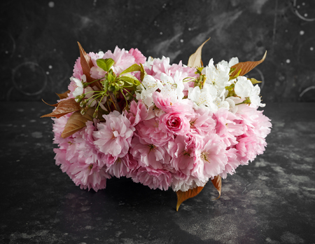 Stylish bridal bouqet of tender white and pink sakura flowersの写真素材