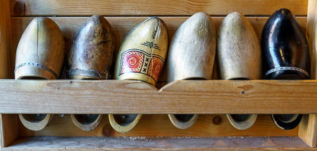 Set of different colorful vintage old Dutch wooden clogs