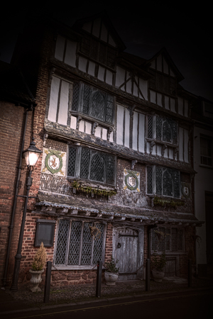 Mystical image of Old Tudor House with lantern in the gloaming, Exe Island, 6 Tudor Street, Exeter, Devon, United Kingdom, December 28, 2017.のeditorial素材