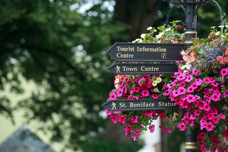 Beautiful Tourist sign on the street, indicating directions and distances to different placesの写真素材