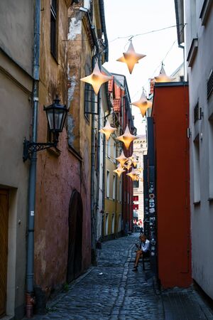 Narrow medieval street in the old Riga city, Latvia July, 2019.のeditorial素材