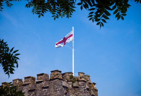 Dartmouth Castle tower with english flag, Devon, United Kingdom, May 23 2018のeditorial素材