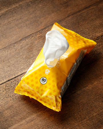 a pack of antibacterial wet wipes on wooden table, Devon, United Kingdom, March 29 2020のeditorial素材