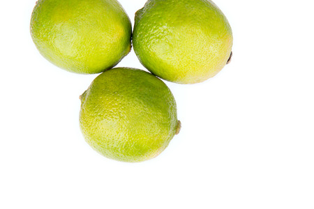 Fresh limes isolated on white backgroundの写真素材