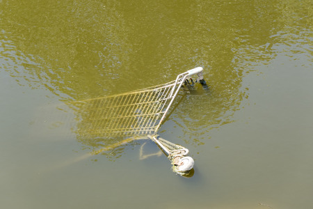 Shopping cart into de riverの写真素材