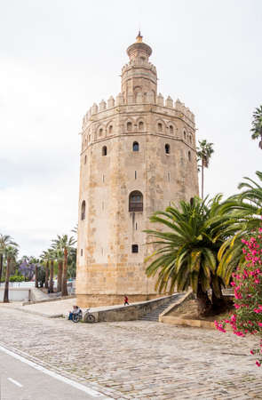 The tourist Torre del Oro in Seville, next to the Guadalquivir river, Andalusia (Spain).のeditorial素材