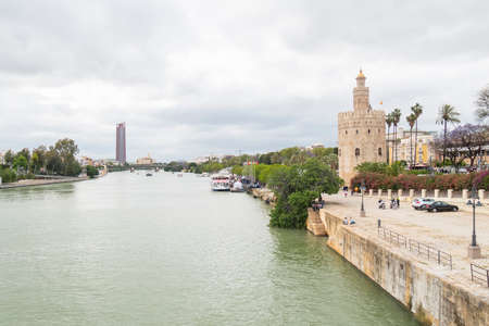 The tourist Torre del Oro in Seville, next to the Guadalquivir river, Andalusia (Spain)のeditorial素材