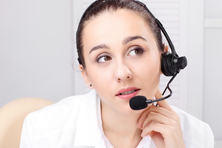 woman with headset over white backgroundの写真素材