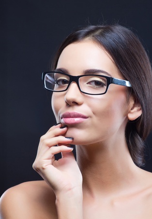 Portrait of nice brunette girl wearing optical glassesの写真素材
