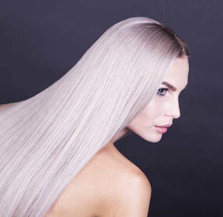 Portrait of a beautiful blonde girl, close up shot from the backの写真素材